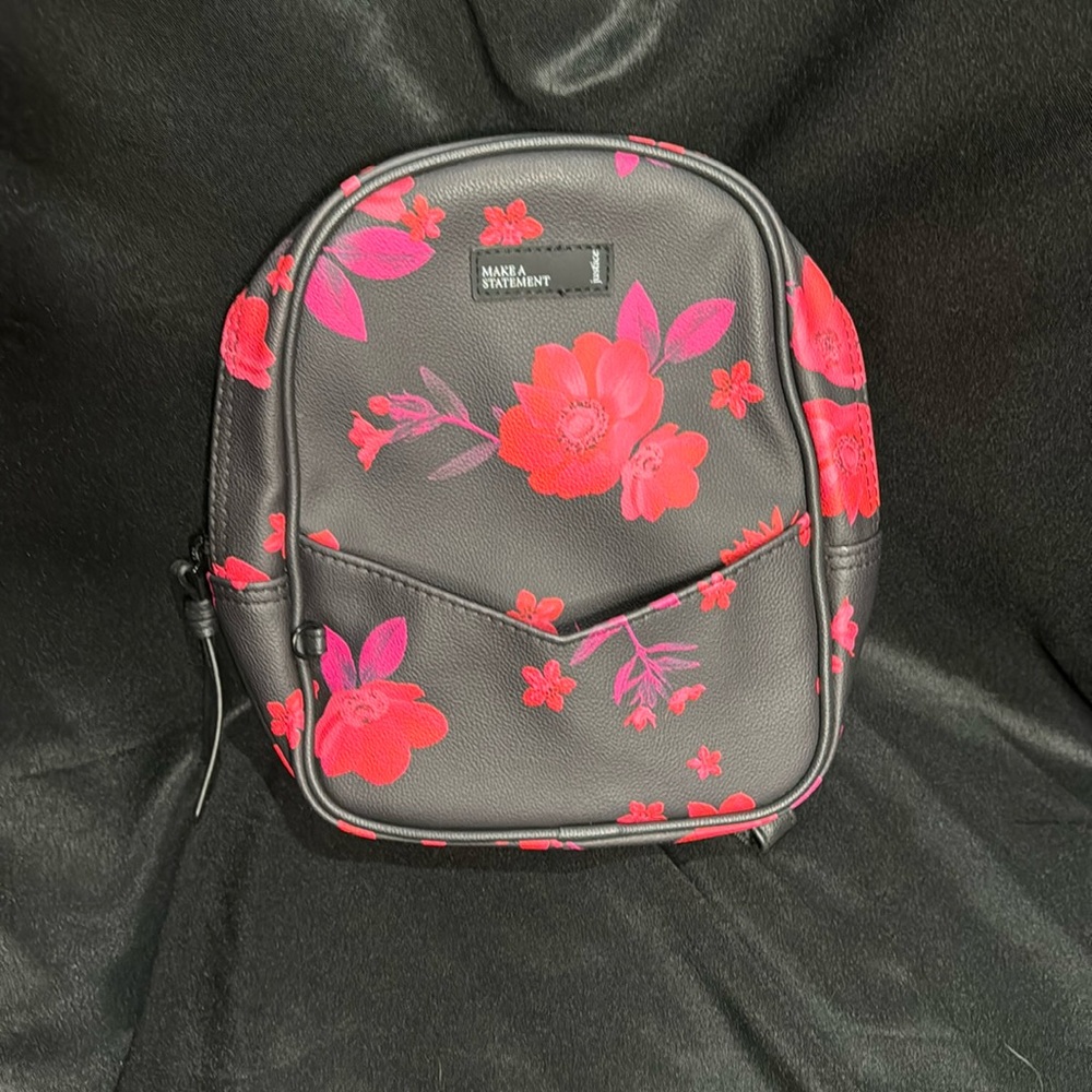 Like new mini Justice backpack